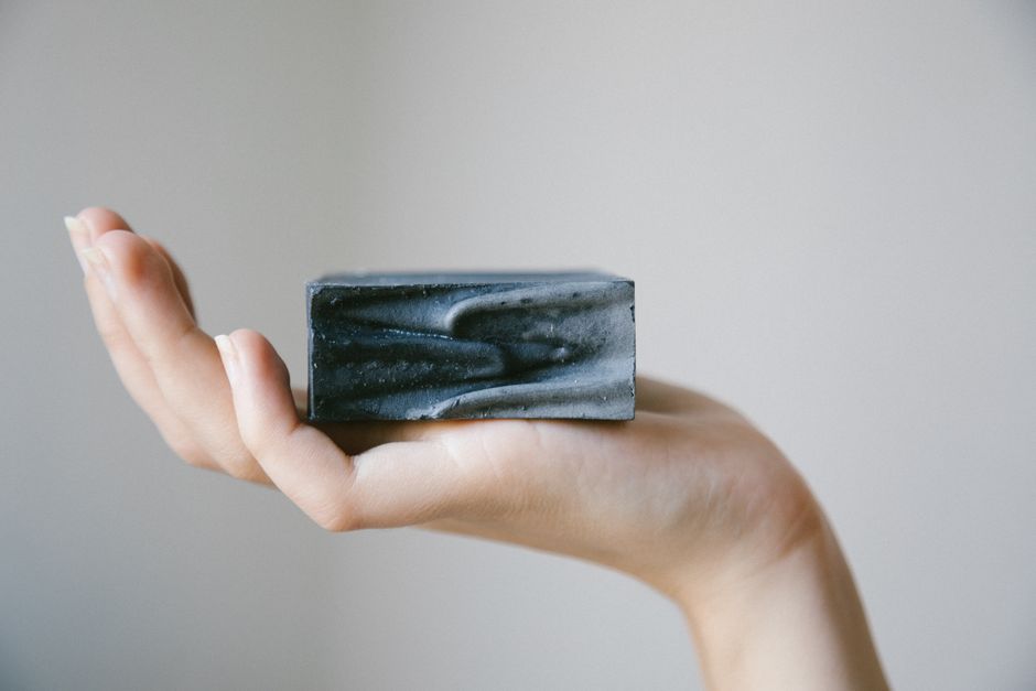 Hand holding a bar of soap