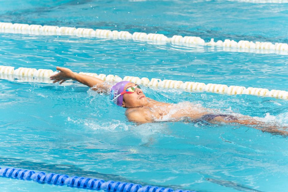 Swimmer doing front crawl in a pool lane